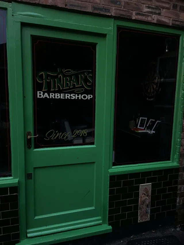 The FINBAR'S Barbershop sign on the door